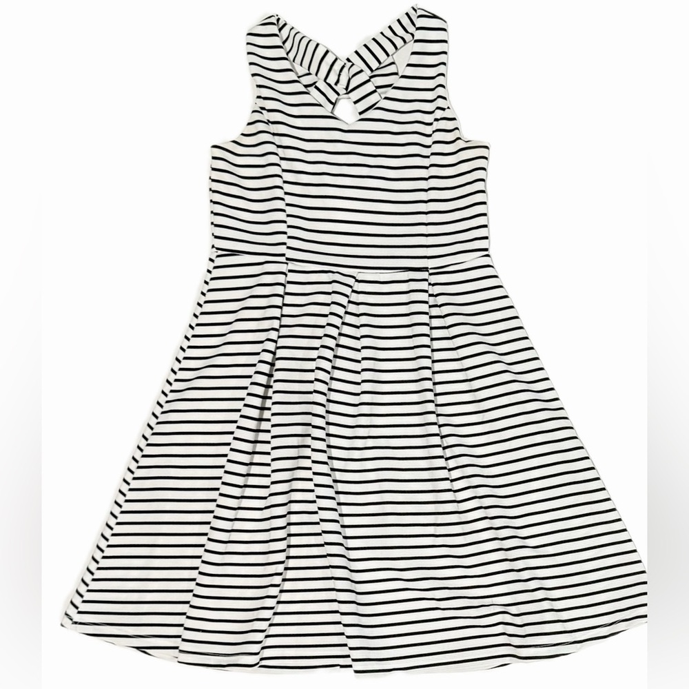 Dress with black and white stripes and bow on the back.